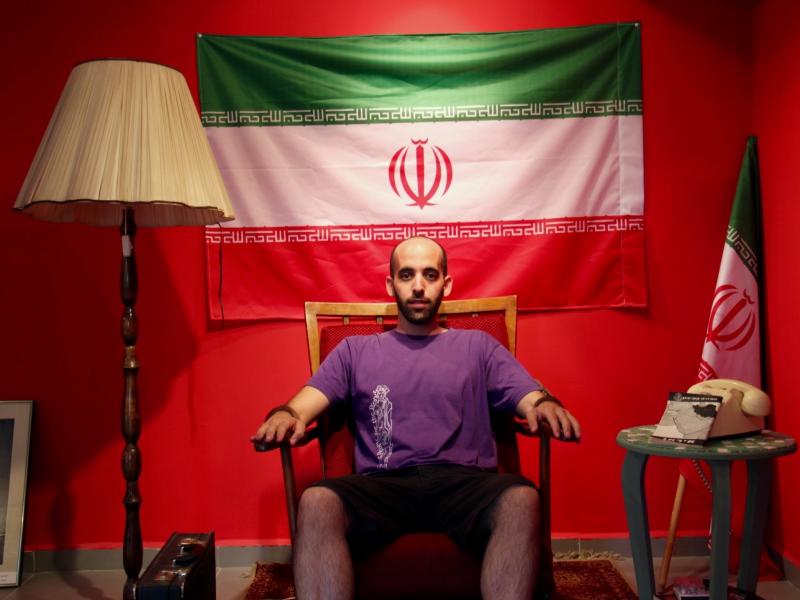 Israeli artist Matan Pinkas sits in the "Iranian Embassy in Jerusalem," a cultural project in the works by the Jerusalem art collective Hamabul. Israeli artist Matan Pinkas sits in the "Iranian Embassy in Jerusalem," a cultural project in the works by the Jerusalem art collective Hamabul.