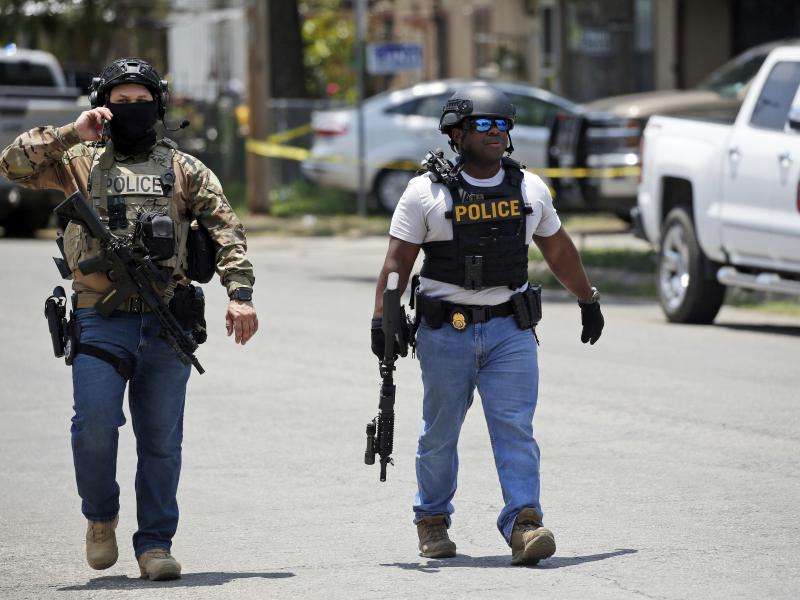 Police walk near Robb Elementary School in Uvalde, Texas, following Tuesday's mass shooting there. Police walk near Robb Elementary School in Uvalde, Texas, following Tuesday's mass shooting there.