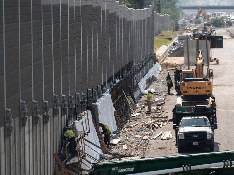 Construction workers build a sound wall along Interstate Highway 66 in Fairfax, Va., this past August. While Congress debates President Biden's infrastructure bill, some rural transportation projects are in limbo. Construction workers build a sound wall along Interstate Highway 66 in Fairfax, Va., this past August. While Congress debates President Biden's infrastructure bill, some rural transportation projects are in limbo.