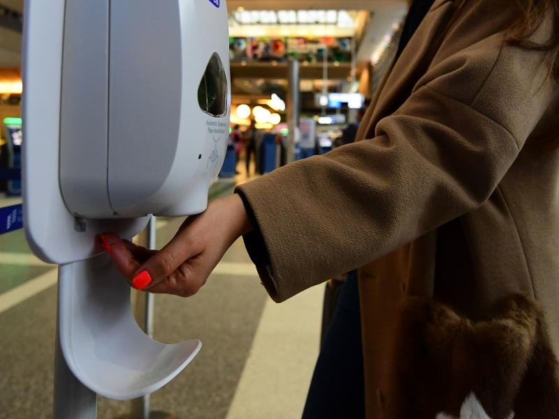 A woman uses hand sanitizer at Los Angeles International Airport on Thursday, the day before the start of the U.S. ban on travel from some European countries amid concern over the coronavirus. A woman uses hand sanitizer at Los Angeles International Airport on Thursday, the day before the start of the U.S. ban on travel from some European countries amid concern over the coronavirus.