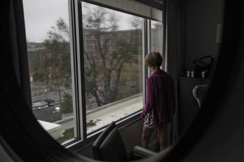 Abbie Hohl watches Hurricane Florence outside a window at Hotel Ballast in Wilmington, N.C., on Friday. The Hohl family lives a half-mile from the hotel but was concerned about flooding from the Cape Fear River. Abbie Hohl watches Hurricane Florence outside a window at Hotel Ballast in Wilmington, N.C., on Friday. The Hohl family lives a half-mile from the hotel but was concerned about flooding from the Cape Fear River.