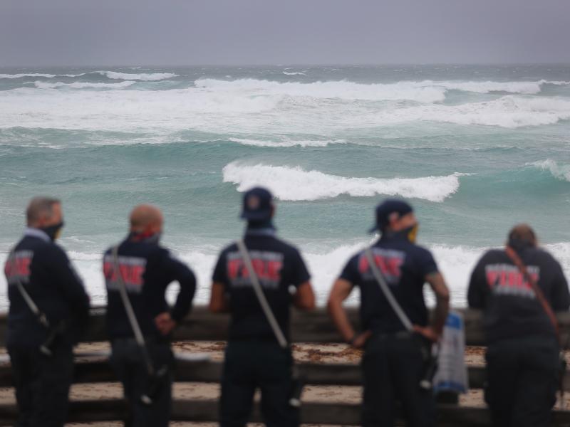 Palm Beach County Fire Rescue check out the ocean as waves crash ashore from Tropical Storm Isaias as it passes through the area on August 2, 2020 in Juno Beach, Fla. Palm Beach County Fire Rescue check out the ocean as waves crash ashore from Tropical Storm Isaias as it passes through the area on August 2, 2020 in Juno Beach, Fla.