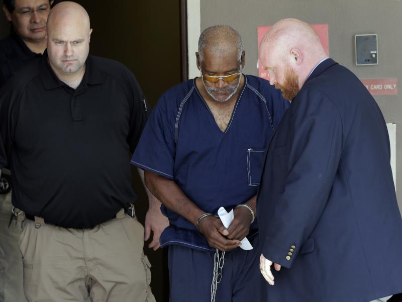 James Mathew Bradley Jr., 60, (center) is escorted out of the federal court house following a hearing Monday in San Antonio. Bradley was arrested in connection with the deaths of 10 people packed into a broiling tractor-trailer. James Mathew Bradley Jr., 60, (center) is escorted out of the federal court house following a hearing Monday in San Antonio. Bradley was arrested in connection with the deaths of 10 people packed into a broiling tractor-trailer.