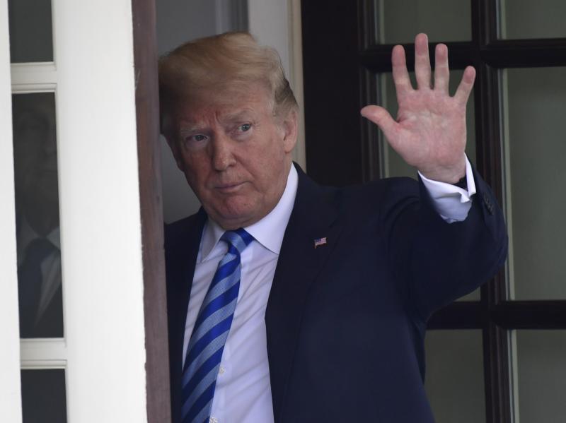 President Trump waves to Uzbek President Shavkat Mirziyoyev as he leaves following a visit to the White House on Wednesday. In his annual disclosure of personal finances, Trump acknowledged that he paid lawyer Michael Cohen between $100,000 and $250,000 l President Trump waves to Uzbek President Shavkat Mirziyoyev as he leaves following a visit to the White House on Wednesday. In his annual disclosure of personal finances, Trump acknowledged that he paid lawyer Michael Cohen between $100,000 and $250,000 l