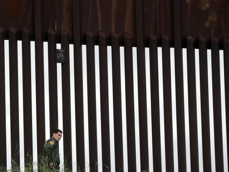 A border patrol agent walks along a border wall separating Tijuana, Mexico, from San Diego in March. The Trump Administration has proposed a number of changes that would restrict asylum claims. A border patrol agent walks along a border wall separating Tijuana, Mexico, from San Diego in March. The Trump Administration has proposed a number of changes that would restrict asylum claims.