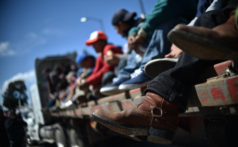 Migrants from Central America ride in a truck Monday as they travel toward the U.S. on the Mexico City-Puebla highway. Thursday, the Trump administration issued new a new rule for asylum-seekers. Migrants from Central America ride in a truck Monday as they travel toward the U.S. on the Mexico City-Puebla highway. Thursday, the Trump administration issued new a new rule for asylum-seekers.