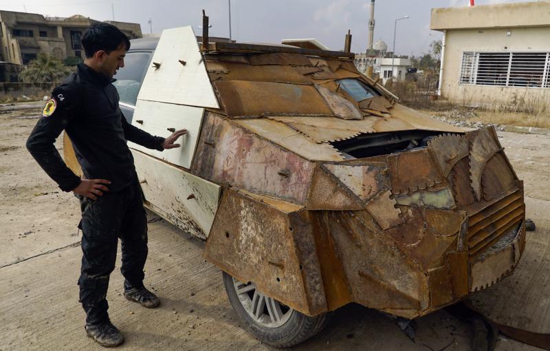 An Iraqi soldier on Sunday stands near a makeshift armored car left behind by the Islamic State when they were driven out of the eastern side of Mosul. President Trump has ordered the U.S. military to draw up a new plan for the fight against ISIS. An Iraqi soldier on Sunday stands near a makeshift armored car left behind by the Islamic State when they were driven out of the eastern side of Mosul. President Trump has ordered the U.S. military to draw up a new plan for the fight against ISIS.