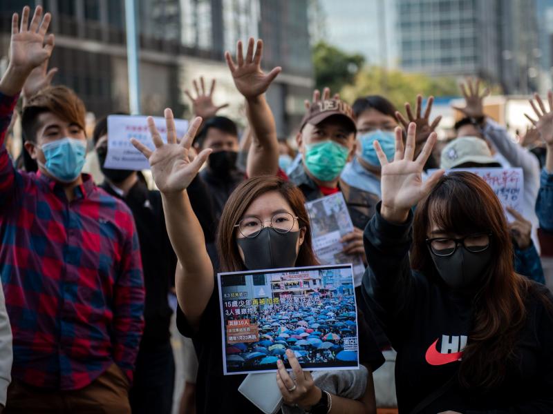 People gather in support of pro-democracy protesters during a lunch break rally in the Kwun Tong area in Hong Kong on Wednesday. Hong Kong has been battered by months of mass rallies and violent clashes between police and protesters who are demanding dire People gather in support of pro-democracy protesters during a lunch break rally in the Kwun Tong area in Hong Kong on Wednesday. Hong Kong has been battered by months of mass rallies and violent clashes between police and protesters who are demanding dire