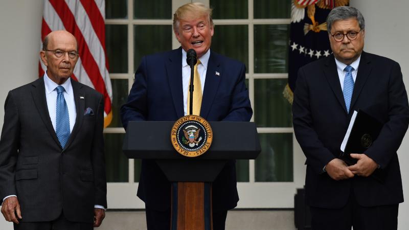 President Trump, flanked by Secretary of Commerce Wilbur Ross (left) and Attorney General William Barr, delivers remarks on citizenship and the census in the Rose Garden at the White House on Thursday. President Trump, flanked by Secretary of Commerce Wilbur Ross (left) and Attorney General William Barr, delivers remarks on citizenship and the census in the Rose Garden at the White House on Thursday.