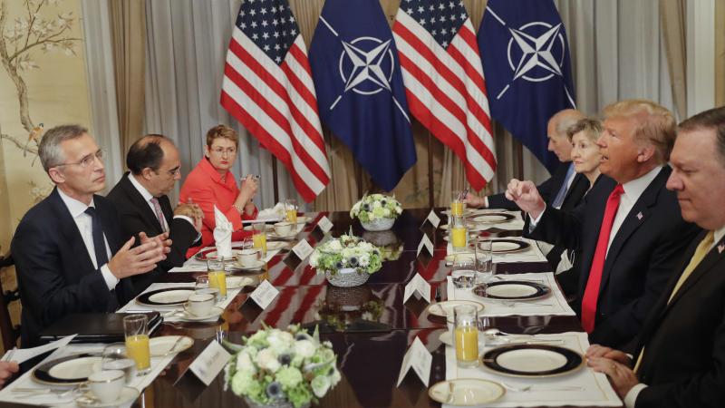 In what was supposed to be a brief photo op ahead of a breakfast meeting, President Trump launched a verbal attack against NATO defense spending as cameras clicked away. In what was supposed to be a brief photo op ahead of a breakfast meeting, President Trump launched a verbal attack against NATO defense spending as cameras clicked away.
