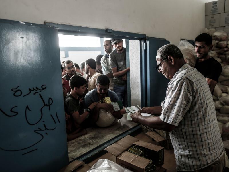 Palestinians receive aid at a United Nations food distribution center in Jabalia refugee camp in the northern Gaza Strip this week. Palestinians receive aid at a United Nations food distribution center in Jabalia refugee camp in the northern Gaza Strip this week.