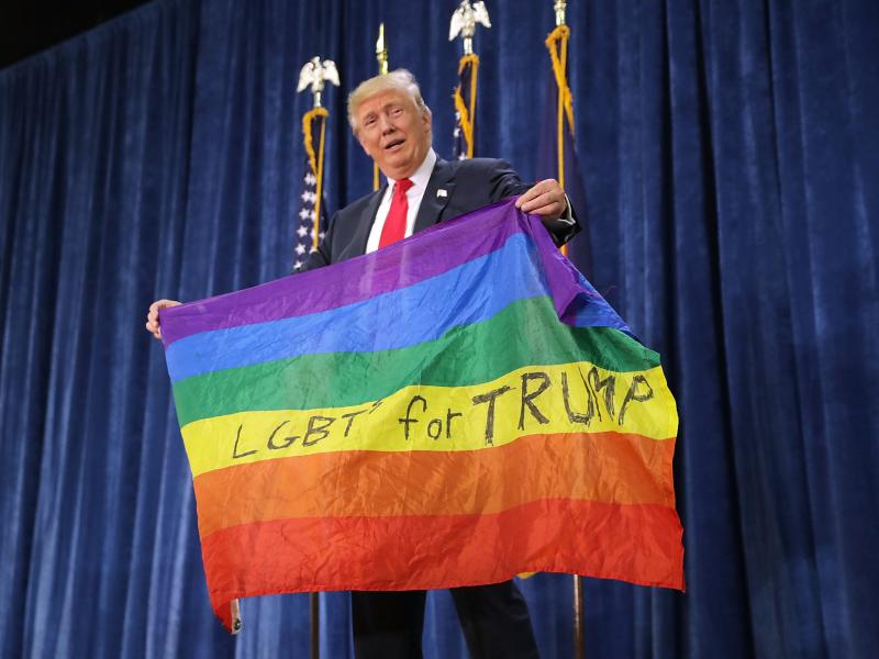 Then-candidate Donald Trump holds an LGBT rainbow flag during an October 2016 presidential campaign rally at the University of Northern Colorado in Greeley, Colo. Then-candidate Donald Trump holds an LGBT rainbow flag during an October 2016 presidential campaign rally at the University of Northern Colorado in Greeley, Colo.