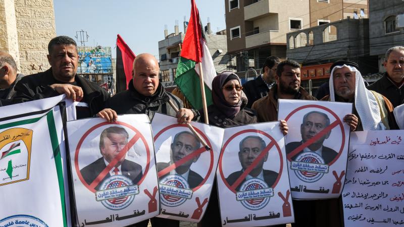 Palestinian demonstrators in Rafah, in the southern Gaza strip, hold portraits of President Trump and Israeli Prime Minister Benjamin Netanyahu during a protest against Trump's announcement of a peace plan on Tuesday. Palestinian demonstrators in Rafah, in the southern Gaza strip, hold portraits of President Trump and Israeli Prime Minister Benjamin Netanyahu during a protest against Trump's announcement of a peace plan on Tuesday.