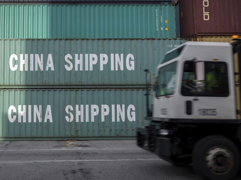 A truck passes a stack of Chinese shipping containers at the Port of Savannah in Georgia in July. A truck passes a stack of Chinese shipping containers at the Port of Savannah in Georgia in July.
