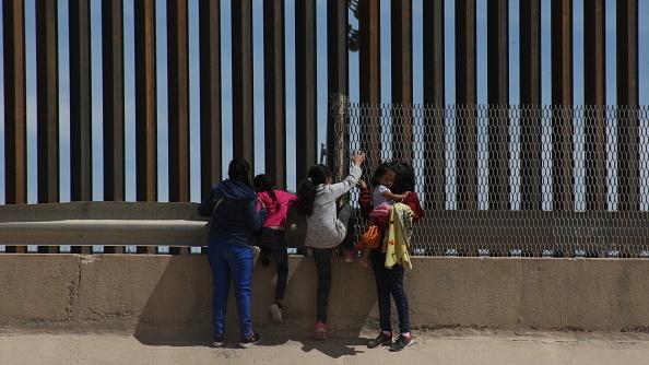 A mother and her three daughters at the border crossing dividing Juárez, Mexico, and El-Paso, Texas. The family traveled from Guatemala to reach the U.S. A mother and her three daughters at the border crossing dividing Juárez, Mexico, and El-Paso, Texas. The family traveled from Guatemala to reach the U.S.