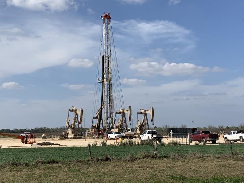 A crew near Karnes City, Texas, continued work as oil prices collapsed this week. Companies already were cutting costs and now will have to cut deeper as oil prices remain low. A crew near Karnes City, Texas, continued work as oil prices collapsed this week. Companies already were cutting costs and now will have to cut deeper as oil prices remain low.