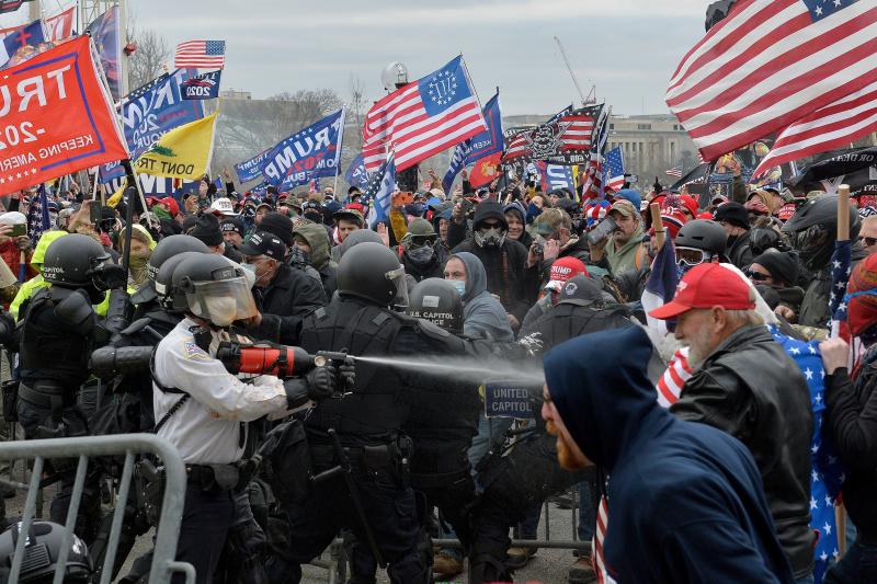 Trump supporters clash with police and security forces as they try to storm the Capitol in Washington, D.C. on Wednesday. Demonstrators breached security and entered the Capitol as Congress debated the 2020 electoral vote certification. Trump supporters clash with police and security forces as they try to storm the Capitol in Washington, D.C. on Wednesday. Demonstrators breached security and entered the Capitol as Congress debated the 2020 electoral vote certification.