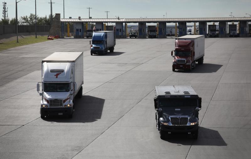 Trucks, including an armored car, pass through U.S. customs in 2016 in Laredo, Texas. Trucks, including an armored car, pass through U.S. customs in 2016 in Laredo, Texas.