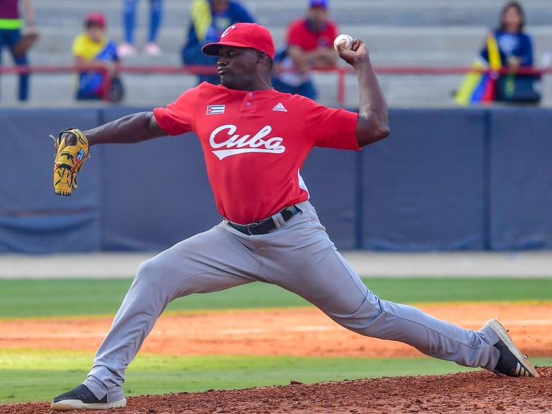 Alexis Rivero of Cuba's Los Leñeros de Las Tunas pitches during a Caribbean Series match against Venezuela's Cardenales de Lara in Panama City on Feb. 6. Major League Baseball had made a deal with Cuba's baseball federation to allow Cuban athletes to pla Alexis Rivero of Cuba's Los Leñeros de Las Tunas pitches during a Caribbean Series match against Venezuela's Cardenales de Lara in Panama City on Feb. 6. Major League Baseball had made a deal with Cuba's baseball federation to allow Cuban athletes to pla