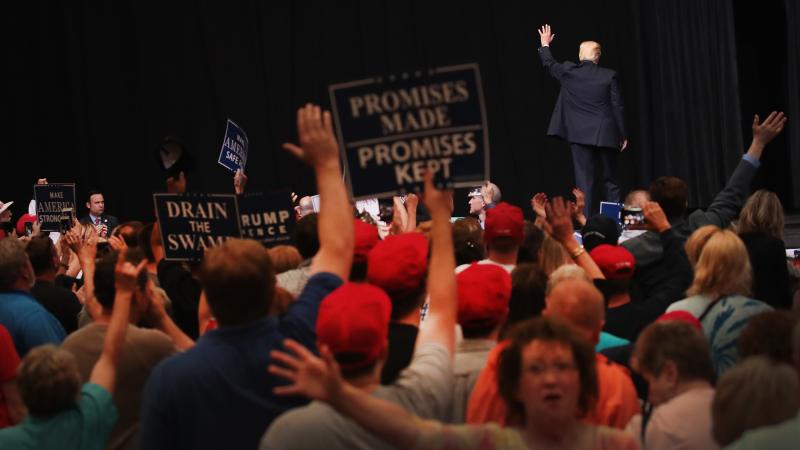 President Donald Trump leaves the stage following a rally on June 21, 2017 in Cedar Rapids, Iowa. President Donald Trump leaves the stage following a rally on June 21, 2017 in Cedar Rapids, Iowa.