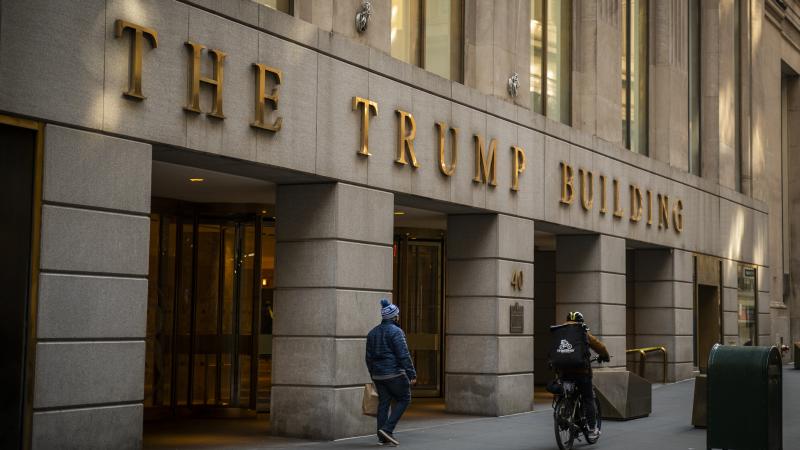 A pedestrian walks past the Trump Building in New York City in January. A pedestrian walks past the Trump Building in New York City in January.