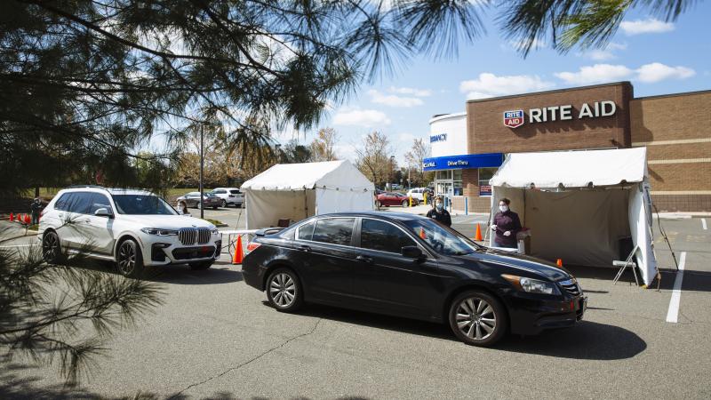 People in cars arrive at a drive-up COVID-19 testing site outside a Rite Aid in Toms River, N.J., on April 22. About 3% of Rite Aid stores are offering testing for the virus. People in cars arrive at a drive-up COVID-19 testing site outside a Rite Aid in Toms River, N.J., on April 22. About 3% of Rite Aid stores are offering testing for the virus.