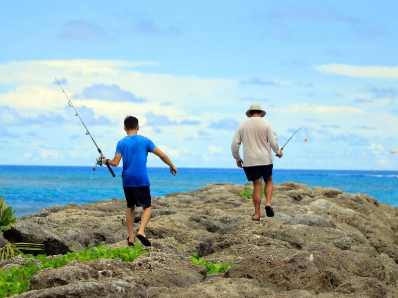 Residents go fishing this week near Tumon Beach in Guam. Some people on the strategically located island fear the president's rhetoric has exposed them to danger. Residents go fishing this week near Tumon Beach in Guam. Some people on the strategically located island fear the president's rhetoric has exposed them to danger.