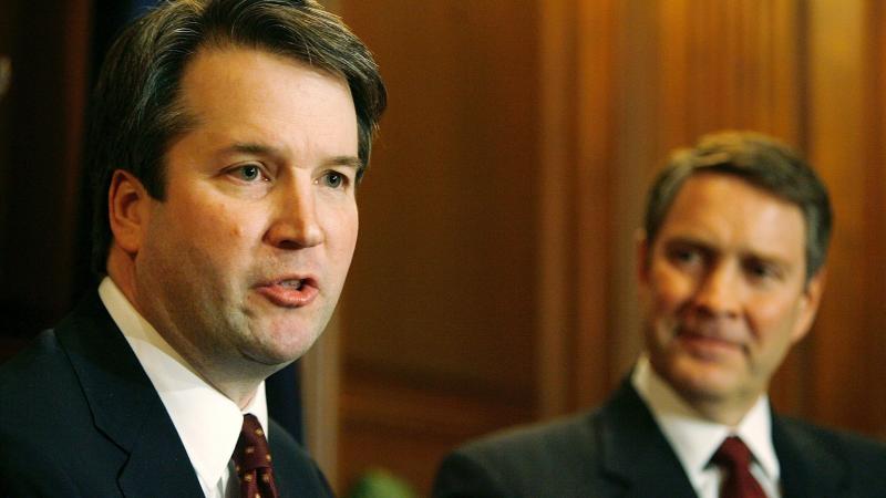 Brett Kavanaugh (left) speaks in 2006 when he was a nominee for the D.C. Circuit Court of Appeals. Then-Senate Majority Leader Bill Frist of Tennessee looks on. Brett Kavanaugh (left) speaks in 2006 when he was a nominee for the D.C. Circuit Court of Appeals. Then-Senate Majority Leader Bill Frist of Tennessee looks on.