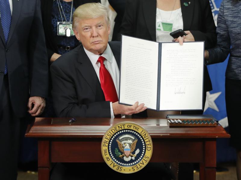 President Trump signs an executive order on immigration enforcement and sanctuary cities on Jan. 25. President Trump signs an executive order on immigration enforcement and sanctuary cities on Jan. 25.