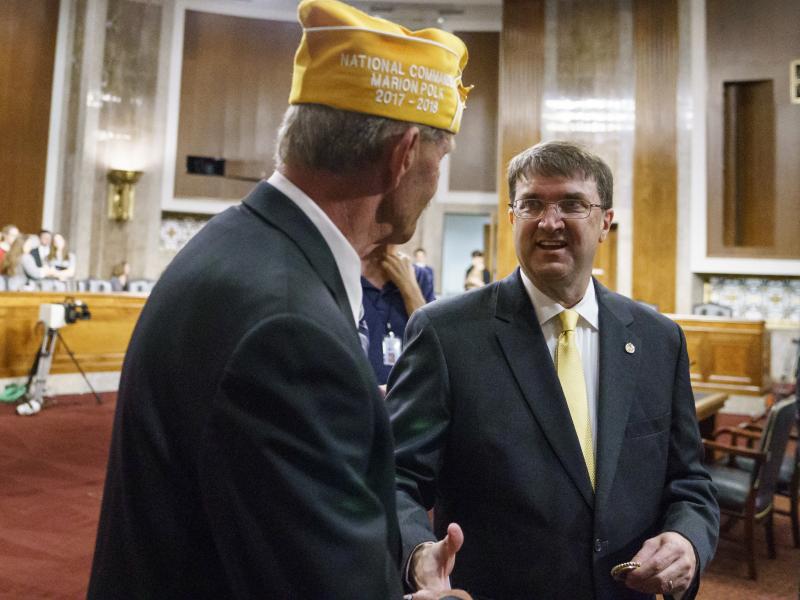 Veterans Affairs secretary nominee Robert Wilkie (right) speaks with Marion Polk, national commander of AMVETS, before testifying at a Senate Veterans Affairs Committee nominations hearing Wednesday. Veterans Affairs secretary nominee Robert Wilkie (right) speaks with Marion Polk, national commander of AMVETS, before testifying at a Senate Veterans Affairs Committee nominations hearing Wednesday.