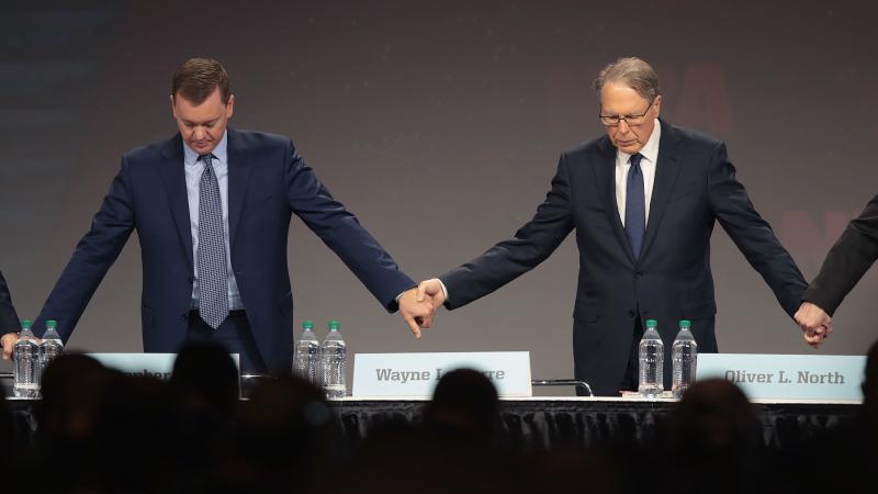 Chris Cox (L), the NRA's chief lobbyist, with CEO Wayne LaPierre at the annual meeting in Indiana in April. Chris Cox (L), the NRA's chief lobbyist, with CEO Wayne LaPierre at the annual meeting in Indiana in April.