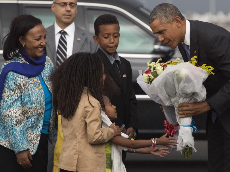 President Obama receives flowers upon his arrival Sunday aboard Air Force One at Bole International Airport in Addis Ababa, Ethiopia. President Obama receives flowers upon his arrival Sunday aboard Air Force One at Bole International Airport in Addis Ababa, Ethiopia.