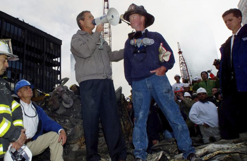 President George W. Bush stands in the rubble of the World Trade Center in New York and speaks to workers involved in the cleanup effort on Sept. 14, 2001. President George W. Bush stands in the rubble of the World Trade Center in New York and speaks to workers involved in the cleanup effort on Sept. 14, 2001.