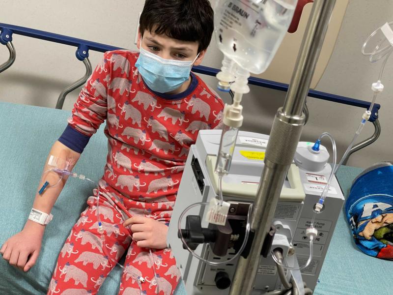 A case of COVID-19 brought 12-year-old Harry Nelson to the emergency room in Syracuse, N.Y., where cases are surging, His mother, photographer Paula Nelson, says he first had mild symptoms — just a headache — but later ran a high fever and began vomit A case of COVID-19 brought 12-year-old Harry Nelson to the emergency room in Syracuse, N.Y., where cases are surging, His mother, photographer Paula Nelson, says he first had mild symptoms — just a headache — but later ran a high fever and began vomit