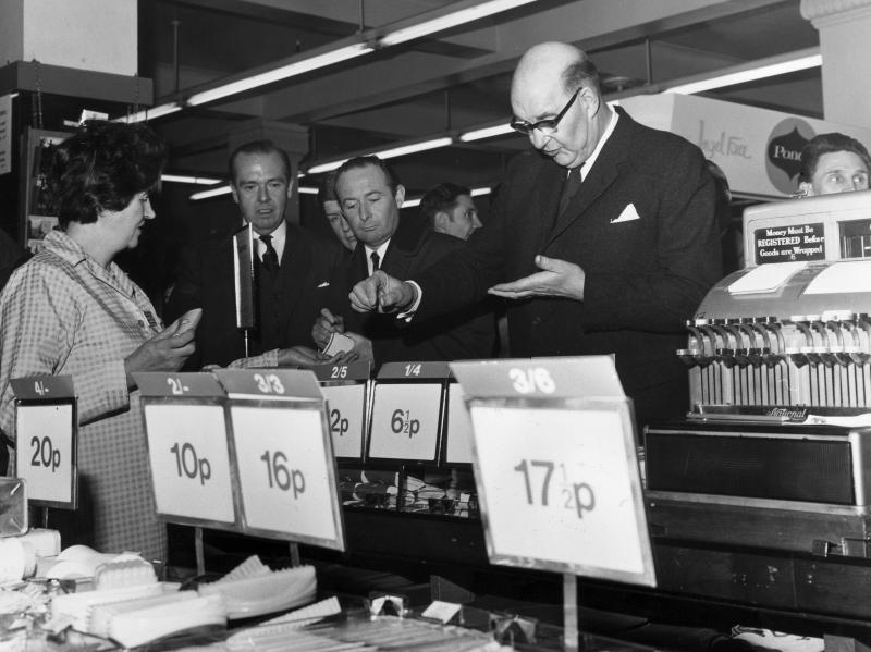 On the day of the official change to decimalized currency on Feb. 15, 1971, Lord Fiske, chairman of the Decimal Currency Board, makes a purchase at a Woolworths store in London. On the day of the official change to decimalized currency on Feb. 15, 1971, Lord Fiske, chairman of the Decimal Currency Board, makes a purchase at a Woolworths store in London.