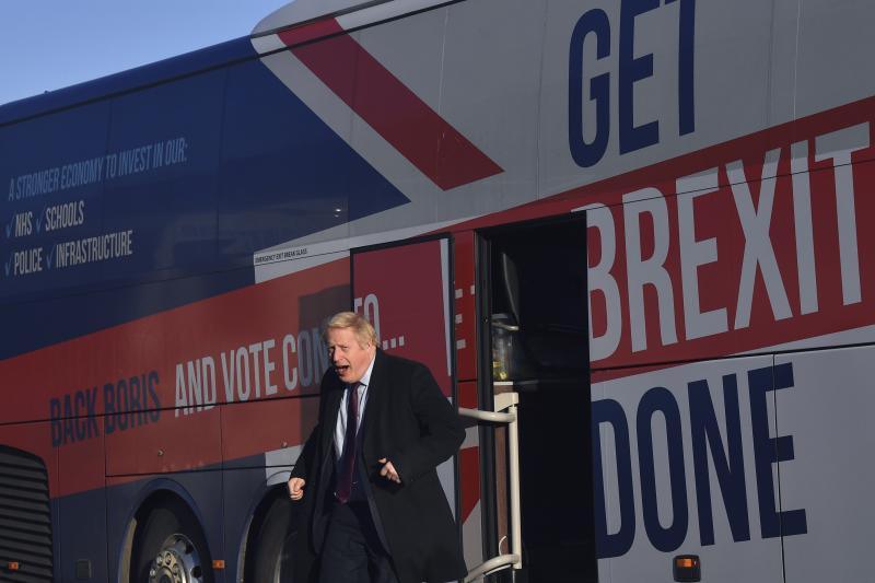 Britain's Prime Minister Boris Johnson gets off his election campaign bus — emblazoned with the slogan "Get Brexit Done" — to visit Washington, England, on Monday. Britain goes to the polls on Thursday. Britain's Prime Minister Boris Johnson gets off his election campaign bus — emblazoned with the slogan "Get Brexit Done" — to visit Washington, England, on Monday. Britain goes to the polls on Thursday.