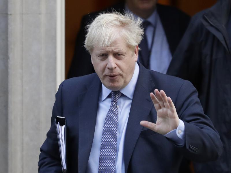 British Prime Minister Boris Johnson leaves No. 10 Downing St. to go to the Houses of Parliament in London on Saturday. British Prime Minister Boris Johnson leaves No. 10 Downing St. to go to the Houses of Parliament in London on Saturday.