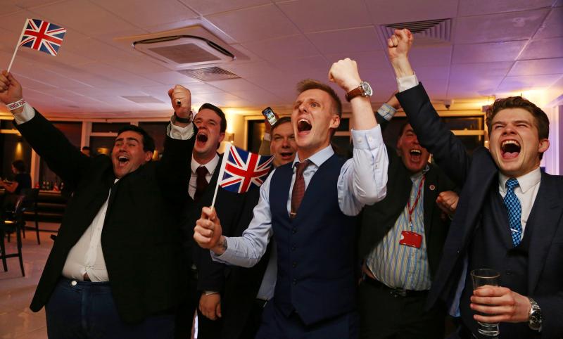 Advocates for the U.K. leaving the EU wave Union flags and cheer as the results come in at the Leave.EU referendum party at Millbank Tower in central London early Friday morning. Advocates for the U.K. leaving the EU wave Union flags and cheer as the results come in at the Leave.EU referendum party at Millbank Tower in central London early Friday morning.