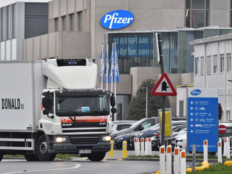 The U.K. will begin a mass vaccination against COVID-19 on Tuesday, as hundreds of thousands of doses of Pfizer's vaccine reach the public. Here, a temperature-controlled cold storage truck leaves a Pfizer facility in Belgium Thursday. The U.K. will begin a mass vaccination against COVID-19 on Tuesday, as hundreds of thousands of doses of Pfizer's vaccine reach the public. Here, a temperature-controlled cold storage truck leaves a Pfizer facility in Belgium Thursday.