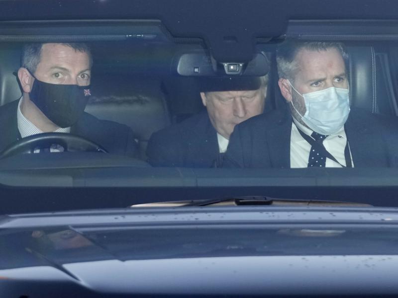 Britain's Prime Minister Boris Johnson, center, sits in a car as he leaves Parliament after attending the weekly Prime Ministers' Questions session in London, Wednesday, Jan. 12, 2022. Britain's Prime Minister Boris Johnson, center, sits in a car as he leaves Parliament after attending the weekly Prime Ministers' Questions session in London, Wednesday, Jan. 12, 2022.