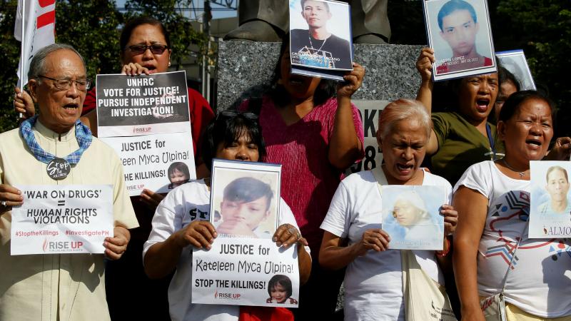 Retired Roman Catholic Bishop Nicanor Yniguez (left) joins families of victims of alleged extra-judicial killings in President Rodrigo Duterte's "war on drugs." Retired Roman Catholic Bishop Nicanor Yniguez (left) joins families of victims of alleged extra-judicial killings in President Rodrigo Duterte's "war on drugs."