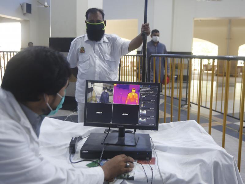 Railway staff in Pakistan use a thermal scanner to check visitors for coronavirus symptoms. Pakistan was one of the nine countries added to the U.N.'s new aid plan. Railway staff in Pakistan use a thermal scanner to check visitors for coronavirus symptoms. Pakistan was one of the nine countries added to the U.N.'s new aid plan.