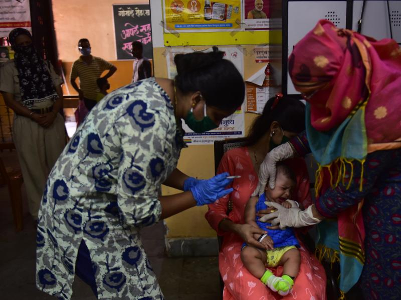 Medical staff in Mumbai, India, last week. A U.N. report warns that the coronavirus pandemic is interfering with children getting vaccinated. Medical staff in Mumbai, India, last week. A U.N. report warns that the coronavirus pandemic is interfering with children getting vaccinated.