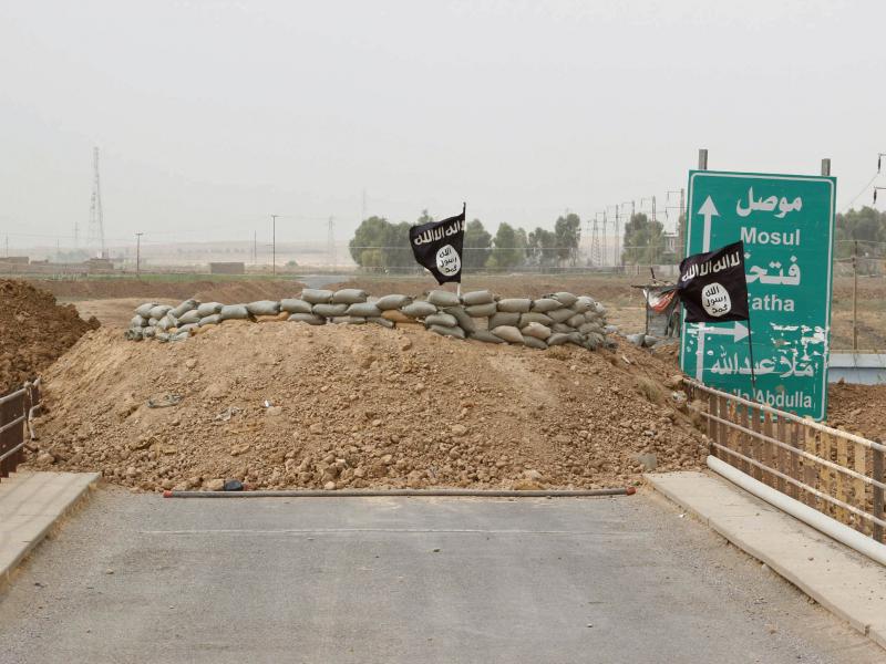 Islamic State flags on the Mullah Abdullah bridge in southern Kirkuk earlier this week. A U.N. report says the extremist group has perpetrated possible war crimes and crimes against humanity. Islamic State flags on the Mullah Abdullah bridge in southern Kirkuk earlier this week. A U.N. report says the extremist group has perpetrated possible war crimes and crimes against humanity.