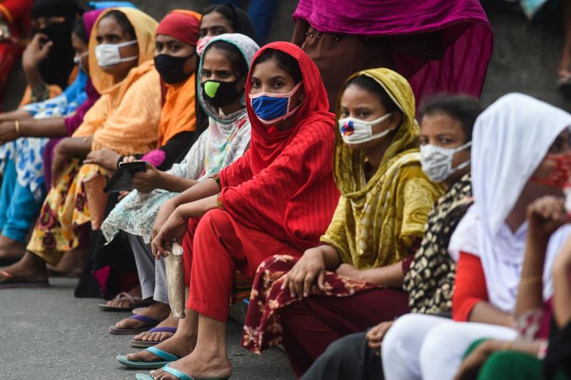 Workers from the garment sector block a road during a protest to demand payment of due wages, in Dhaka, Bangladesh, in April. Thousands of garment workers who produce items for top Western fashion brands protested against unpaid wages, saying they were mo Workers from the garment sector block a road during a protest to demand payment of due wages, in Dhaka, Bangladesh, in April. Thousands of garment workers who produce items for top Western fashion brands protested against unpaid wages, saying they were mo