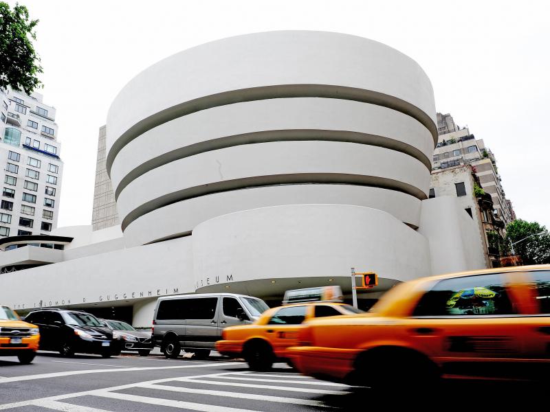 The Guggenheim Museum, designed by Frank Lloyd Wright who developed the concept of "organic architecture," that a building should develop out of its surroundings. The Guggenheim Museum, designed by Frank Lloyd Wright who developed the concept of "organic architecture," that a building should develop out of its surroundings.