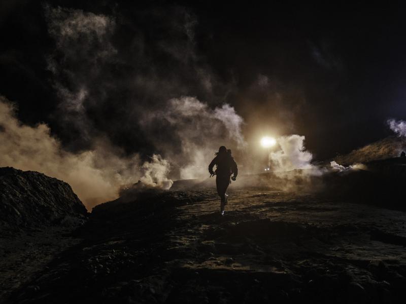 Migrants run as tear gas is thrown by U.S. Customs and Border Protection agents to the Mexican side of the border fence after they climbed the fence to get to San Diego from Tijuana, Mexico. Migrants run as tear gas is thrown by U.S. Customs and Border Protection agents to the Mexican side of the border fence after they climbed the fence to get to San Diego from Tijuana, Mexico.
