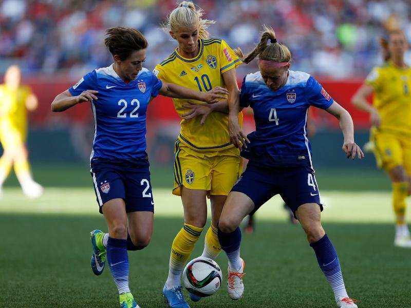 Defenders Meghan Klingenberg, left, and Becky Sauerbrunn of the United States sandwich Sofia Jakobsson of Sweden on Friday during their Group D World Cup match in Winnipeg, Canada. Defenders Meghan Klingenberg, left, and Becky Sauerbrunn of the United States sandwich Sofia Jakobsson of Sweden on Friday during their Group D World Cup match in Winnipeg, Canada.