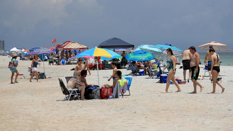 People visit Jacksonville Beach on Saturday in Jacksonville Beach, Florida. Coronavirus cases are spiking in states including Florida, Texas and Arizona. People visit Jacksonville Beach on Saturday in Jacksonville Beach, Florida. Coronavirus cases are spiking in states including Florida, Texas and Arizona.