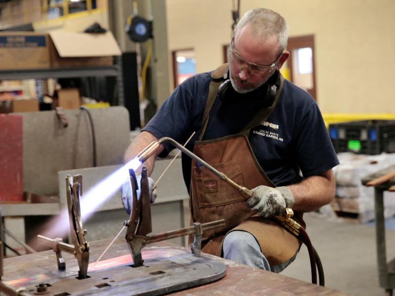 Nate Poort works on braizing loops together for transformers at RoMan Manufacturing in Grand Rapids, Mich., on Dec. 12, 2018. Nate Poort works on braizing loops together for transformers at RoMan Manufacturing in Grand Rapids, Mich., on Dec. 12, 2018.